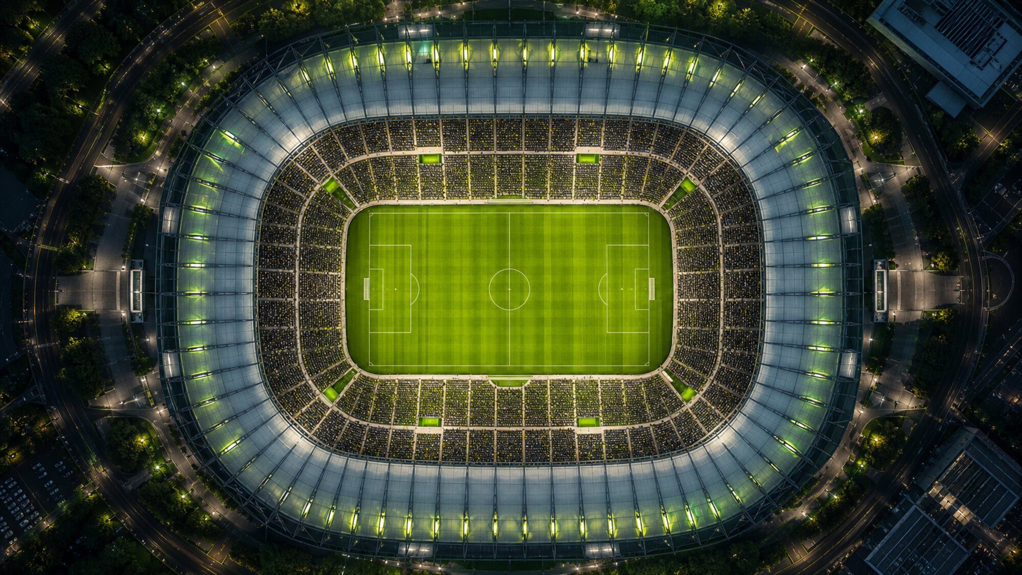 Aerial view of a floodlit stadium